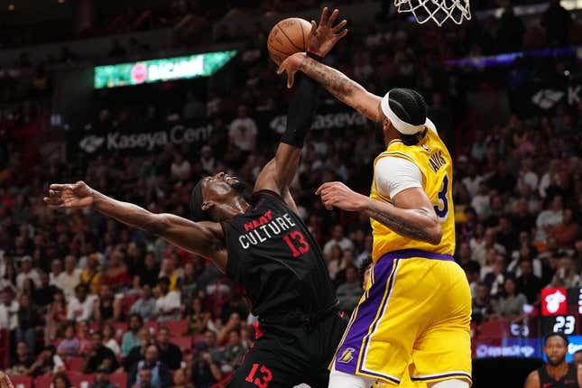 Nov 6, 2023; Miami, Florida, USA; Los Angeles Lakers forward Anthony Davis (3) fouls Miami Heat center Bam Adebayo (13) during the first half at Kaseya Center.