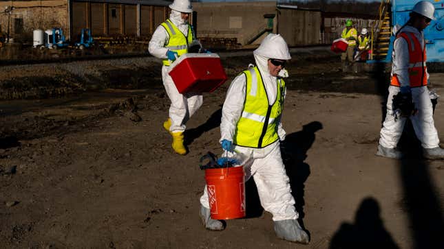 Environmental Protection Agency contractors with  soil samples from the site of the 2023 derailment in East Palestine, Ohio. 