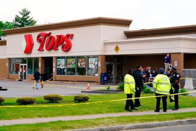 Investigators work the scene of a shooting at a supermarket, in Buffalo, N.Y., Monday, May 16, 2022. 