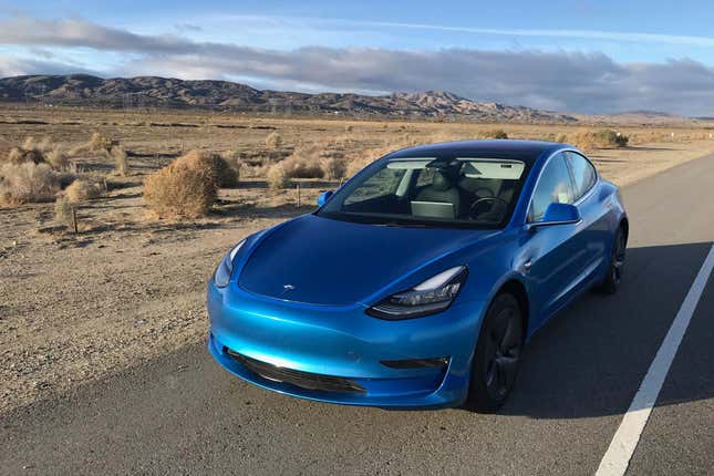 This photo provided by Edmunds shows a 2017 Tesla Model 3 fitted with an aftermarket vinyl wrap. Wrapping your vehicle gives it a fresh and distinctive look. (Courtesy of Edmunds via AP)