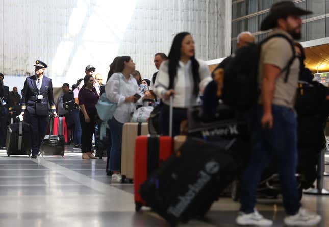 Travelers gather with their luggage in the departures area of the international terminal at Los Angeles International Airport (LAX) on August 31, 2023 in Los Angeles, California.