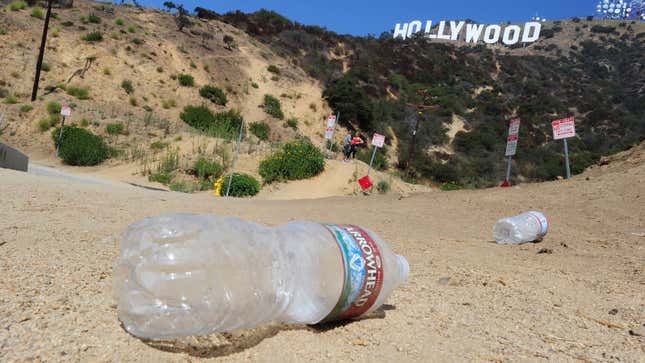 Empty water bottles litter the ground at a popular Hollywood sign viewing area.