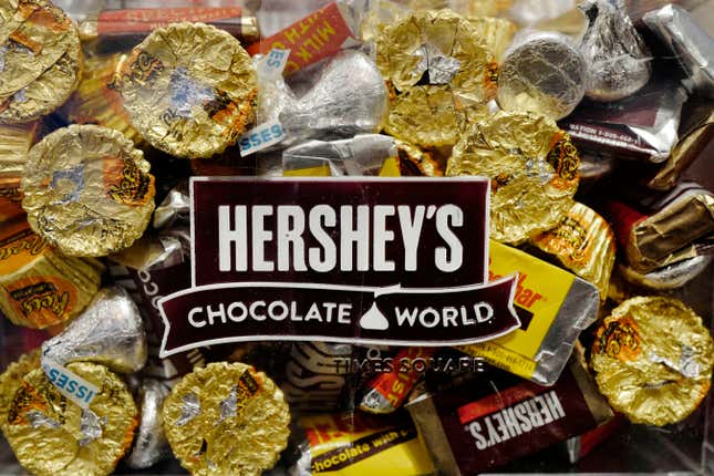 FILE - A mixture of Hershey&#39;s chocolates is displayed in the company&#39;s Times Square store, March 1, 2017, in New York. Hershey is cautioning on its 2024 profit growth as the company contends with rising cocoa costs that are leading to higher prices for chocolate. Cocoa futures prices have doubled over the past year and hit an unprecedented $5,874 per metric ton Friday, Feb. 9, 2024, in intraday trading. (AP Photo/Mark Lennihan, File)