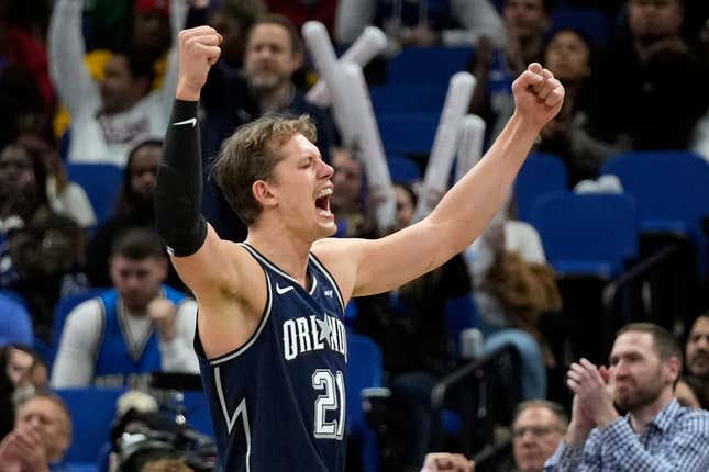 Orlando Magic center Moritz Wagner (21) celebrates after Paolo Banchero made a basket and drew a foul to set up a 3-point play during the second half of the team&#39;s NBA basketball game against the Detroit Pistons, Friday, Dec. 8, 2023, in Orlando, Fla. (AP Photo/John Raoux)