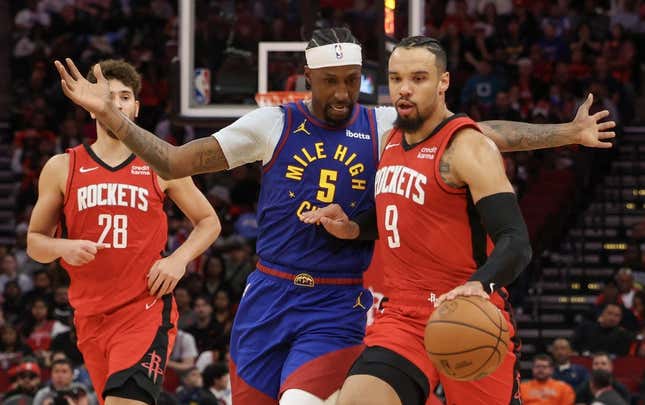 Nov 12, 2023; Houston, Texas, USA; Houston Rockets forward Dillon Brooks (9) dribbles against Denver Nuggets guard Kentavious Caldwell-Pope (5) in the second quarter at Toyota Center.