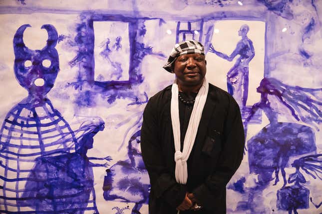BARCELONA, SPAIN - SEPTEMBER 22: Cameroonian artist Barthelemy Toguo poses for a portrait next to his work “Las Meninas” during his new exhibition at the Museu Picasso on September 22, 2022.