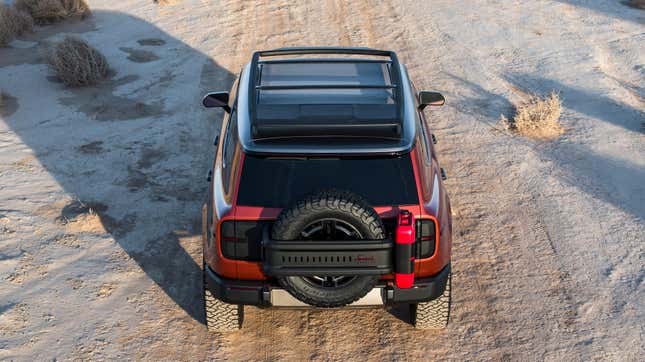 A photo of the rear of a Scout Traveler with a gas can mounted next to the spare tire 