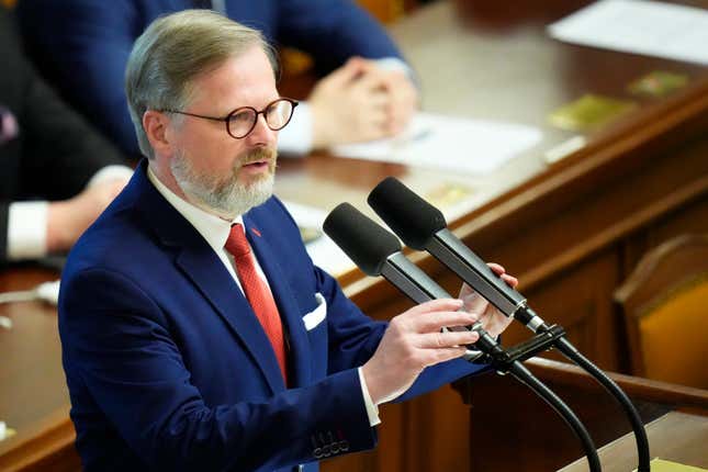 FILE - Czech Republic&#39;s Prime Minister Petr Fiala delivers a speech at the Parliament in Prague, Czech Republic, Wednesday, June 15, 2022. The Czech parliament’s lower house on Friday, Oct. 13, 2023 approved dozens of measures proposed by the government designed to keep the ballooning budget deficit under control. In the 200-seat house, 108 lawmakers from the ruling coalition voted in favor of the plan, while 86 opposition members were against. (AP Photo/Petr David Josek/File)