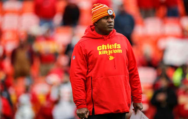 Kansas City Chiefs offensive coordinator Eric Bieniemy watches pregame warmups prior to the game against the Los Angeles Chargersat Arrowhead Stadium on December 29, 2019 in Kansas City, Missouri. 