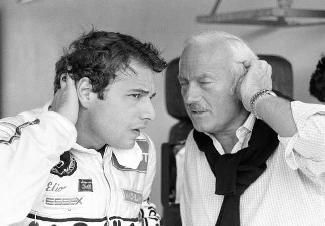 Elio de Angelis (left) and Colin Chapman (right) during practice for the 1981 Spanish Grand Prix