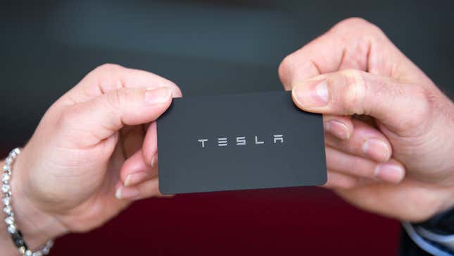 A photo of a black card that's used as a Tesla key. 