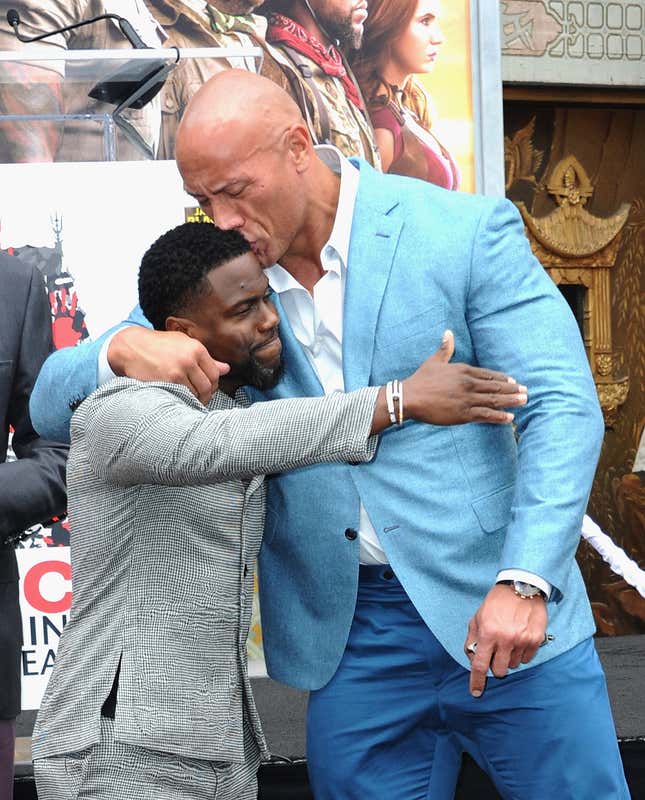 HOLLYWOOD, CA - DECEMBER 10: Kevin Hart and Dwayne Johnson at Kevin Hart’s Hand And Footprint Ceremony At the TCL Chinese Theatre IMAX held at TCL Chinese Theatre on December 10, 2019 in Hollywood, California. 