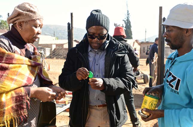 Director Mandla Dube, center, on the set of 'Kalushi' with Dr. Gcina Mhlope, who portrays Mahlangu's mother.