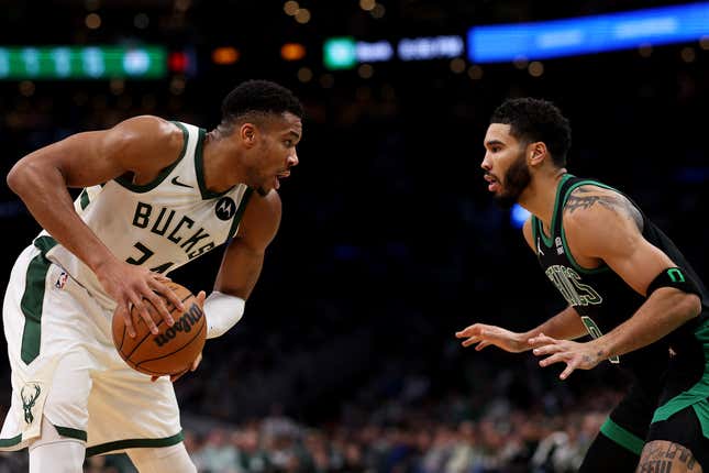 BOSTON, MASSACHUSETTS - NOVEMBER 22: Jayson Tatum #0 of the Boston Celtics defends Giannis Antetokounmpo #34 of the Milwaukee Bucks during the first quarter at TD Garden on November 22, 2023 in Boston, Massachusetts.  NOTE TO USER: User expressly acknowledges and agrees that by downloading and/or using this photo, user agrees to the terms and conditions of the Getty Images License Agreement.  (Photo by Maddie Meyer/Getty Images)