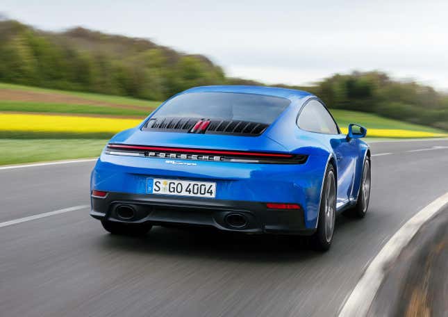 Rear 3/4 view of a blue 2025 Porsche 911 Carrera