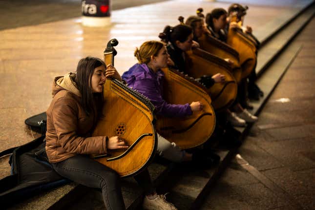 Ukrainian Kobza music band members play traditional &quot;bandura&quot; instruments in a passage under the Independence square in central Kyiv, Saturday, April 20, 2024. (AP Photo/Francisco Seco)