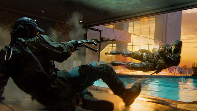 Military operators dive to the ground while shooting. 