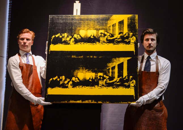 Employees at Bukowski Auction House display Andy Warhol's 'Last Supper', in Stockholm, Wednesday, May 14, 2014. The painting was sold at Bukowski Contemorary auction sale for 6.8 million euro (9.3 million dollars). (AP Photo/Per Larsson, TT news agency) SWEDEN OUT