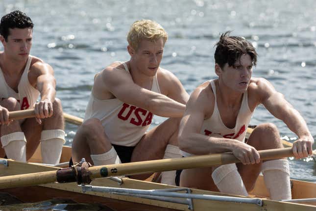 Bruce Herbelin-Earle, Callum Turner, and Jack Mulherne row a boat in The Boys In The Boat
