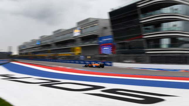 A photo of Daniel Ricciardo driving round the Sochi Autodrome in his orange McLaren F1 car. 