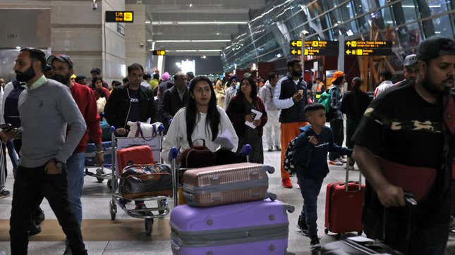 Travelers at Indira Gandhi International Airport