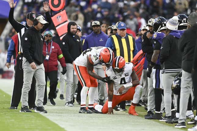 Nov 12, 2023; Baltimore, Maryland, USA;  Cleveland Browns quarterback Deshaun Watson (4) is helped up by  running back Jerome Ford (34) after being tackled out of bounds during the second half against the Baltimore Ravens at M&amp;amp;T Bank Stadium.