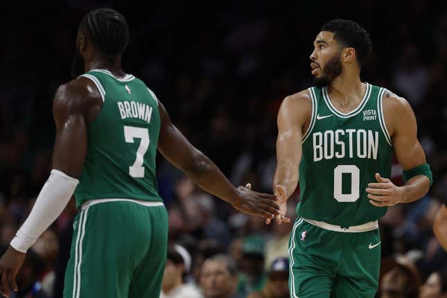 Oct 30, 2023; Washington, District of Columbia, USA; Boston Celtics forward Jayson Tatum (0) celebrates with Celtics guard Jaylen Brown (7) against the Washington Wizards in the third quarter at Capital One Arena.