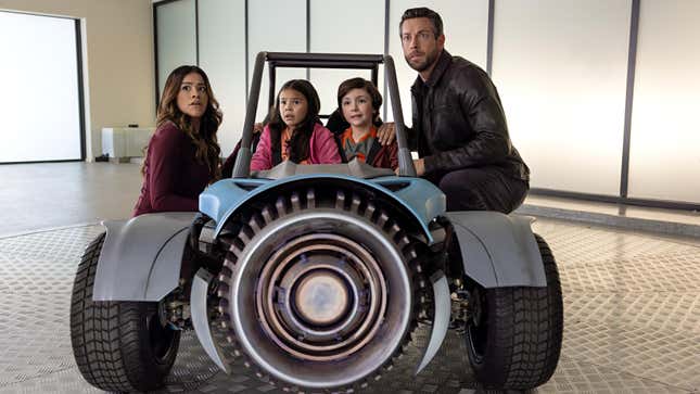 Gina Rodriguez, Everly Carganilla, Connor Esterson, and Zachary Levi in Spy Kids: Armageddon.