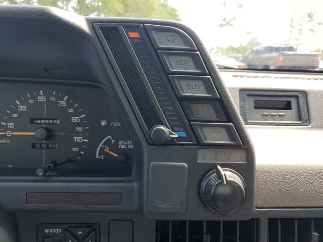 A photo of the climate controls attached to the gauge cluster