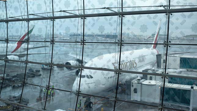 A plane waits for its gate at Dubai International Airport