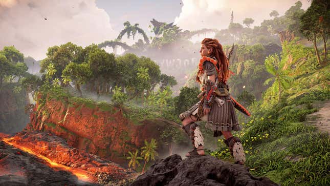 Aloy stands on a hill overlooking lava and trees