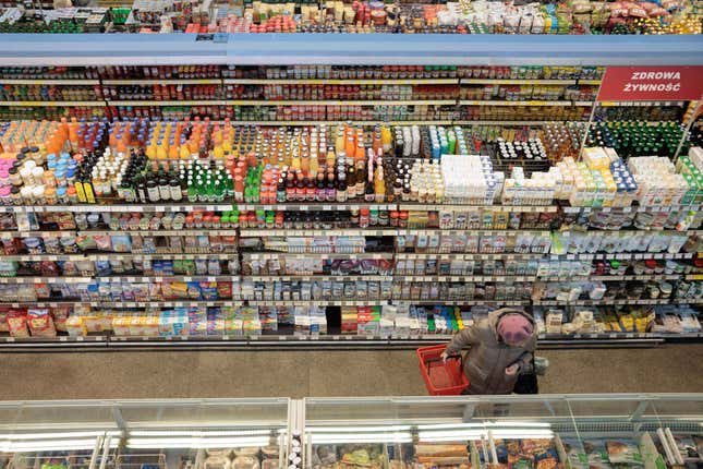 FILE - A woman shops at a supermarket in Warsaw, Poland, on Dec. 9, 2022. Poland&#39;s central bank lowered its interest rates by 75 basis points on Wednesday Sept. 6, 2023 despite the country&#39;s double-digit inflation rate. The move prompted concerns that the central bank was wading into politics with a premature rate cut to help the populist governing party ahead of parliamentary elections next month.(AP Photo/Michal Dyjuk, File)