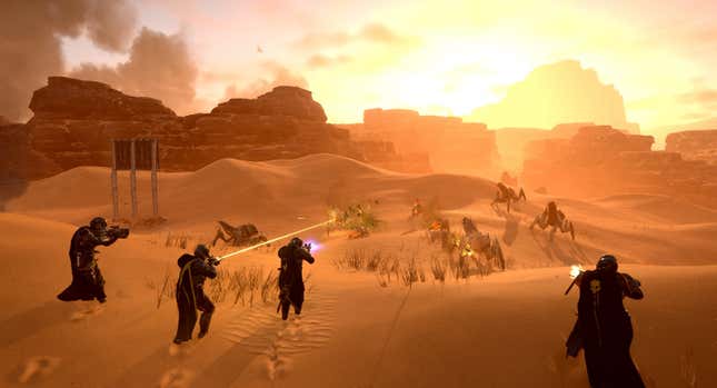 A screenshot of a squad of Helldivers 2 players fighting off bugs on a desert planet that resembles Hellmire.