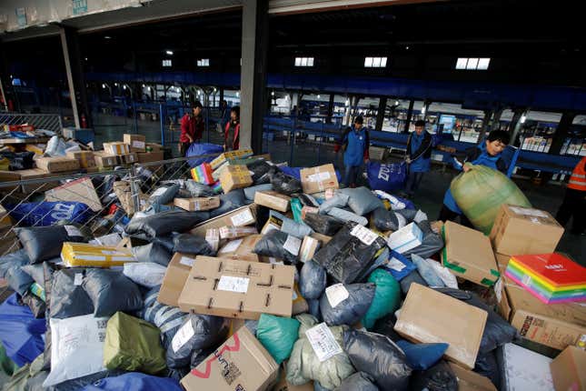 Employees sort parcels at a logistic centre of ZTO Express during the Alibaba 11.11 global shopping festival, in Beijing, China November 11, 2016.