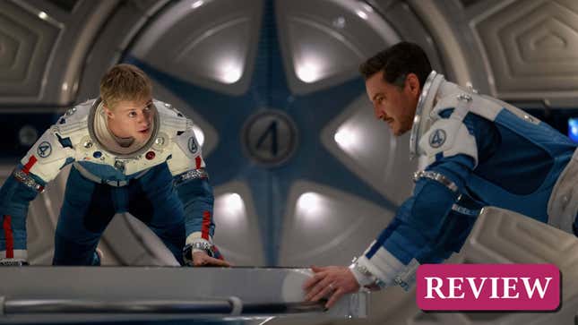 Johnny and Reed float in their spaceship.
