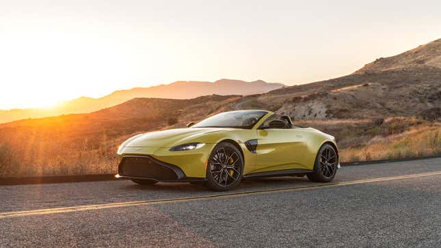 A photo of a yellow Aston Martin Vantage roadster. 