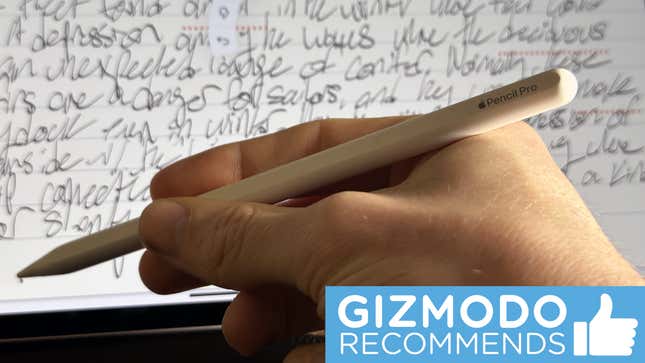 The Apple Pencil Pro held in hand in front of an iPad screen with a small sticker reading Gizmodo Recommends