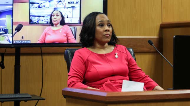 ATLANTA, GA - FEBRUARY 15: Fulton County District Attorney Fani Willis takes the stand as a witness during a hearing in the case of the State of Georgia v. Donald John Trump at the Fulton County Courthouse on February 15, 2024 in Atlanta, Georgia. Judge Scott McAfee is hearing testimony as to whether Willis and Special Prosecutor Nathan Wade should be disqualified from the case for allegedly lying about a personal relationship.