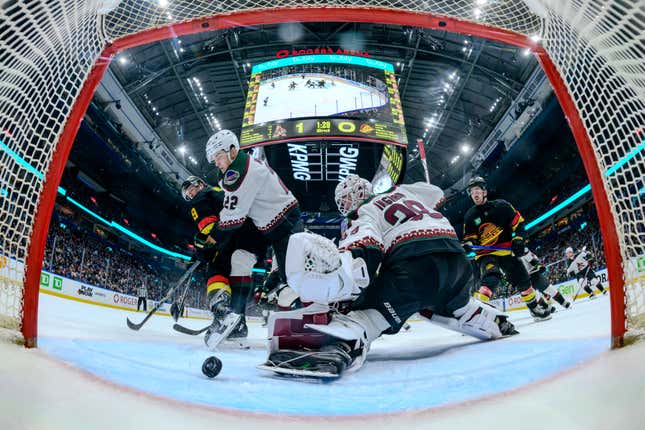 VANCOUVER, CANADA - APRIL 10: J.T. Miller #9 of the Vancouver Canucks scores a goal against Connor Ingram #39 of the Arizona Coyotes during the second period of their NHL game at Rogers Arena on April 10, 2024 in Vancouver, British Columbia, Canada. (Photo by Derek Cain/Getty Images)
