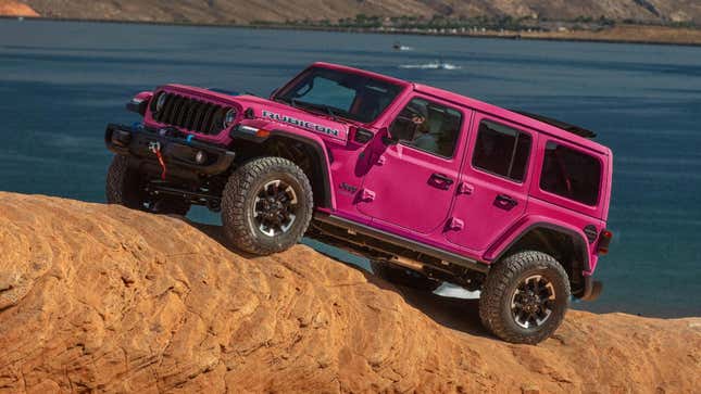 Front 3/4 view of a pink Jeep Wrangler