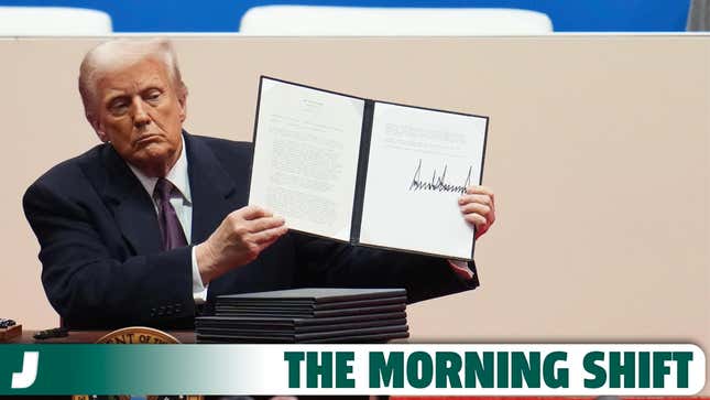  U.S. President Donald Trump holds up an executive orders after signing it during an indoor inauguration parade at Capital One Arena on January 20, 2025 in Washington, DC.