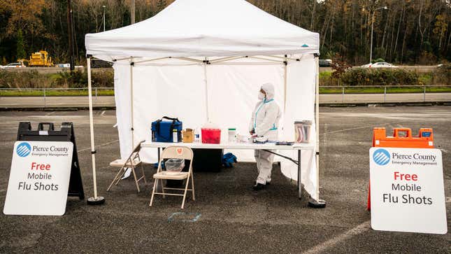 A nurse waits to administer flu shots during a COVID-19 testing and flu shot event at the Tacoma Dome on November 28, 2020 in Tacoma, Washington.