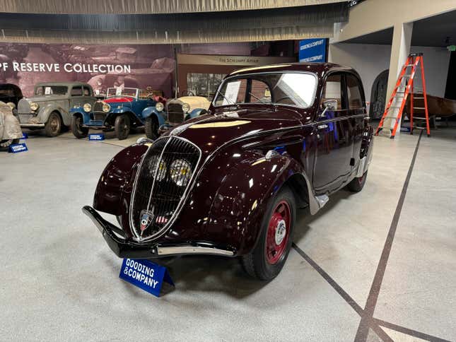 Front 3/4 view of a red 1939 Peugeot 202 Berline