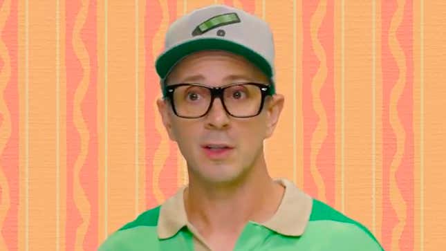 Blue's Clues host Steve Burns in a baseball cap and green shirt in front of an orange and pink background.