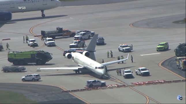 An image showing a plane on a runway with its tail snapped off. 