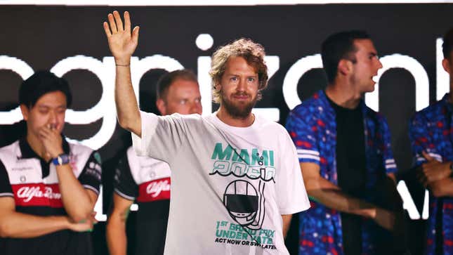 Sebastian Vettel poses in a climate change shirt at Miami GP