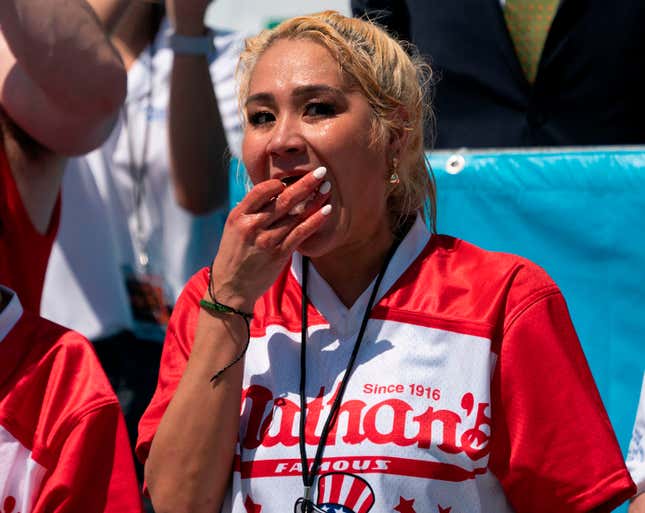 Miki Sudo scarfs down a hot dog, as one does in a hot-dog eating competition.