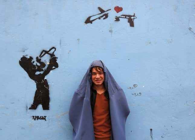 Image for article titled These awesome Afghan guys wore burqas for women’s rights