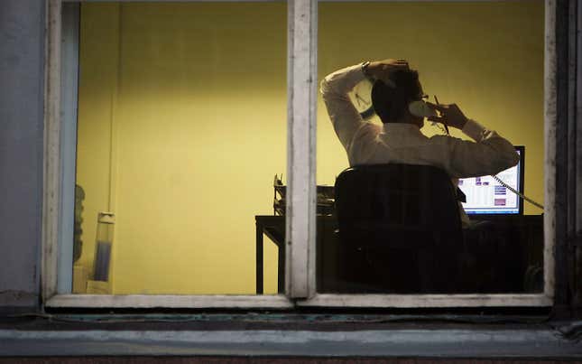 Man working seen through a window