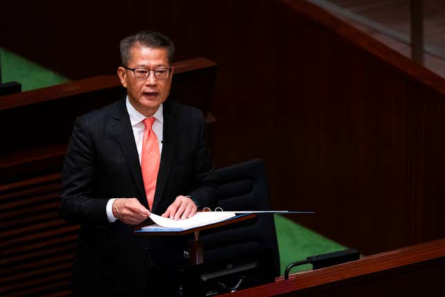 Hong Kong&#39;s Finance Secretary Paul Chan delivers the annual budget address at the Legislative Council in Hong Kong, Wednesday, Feb. 28, 2024. (AP Photo/Louise Delmotte)